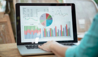 Person working on accounting software on laptop