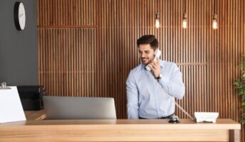 Worker using a hotel phone system
