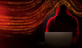Hacker working on computer