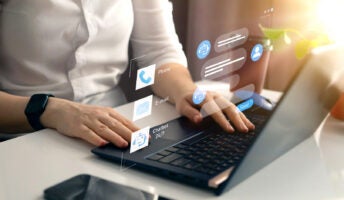 Person working on CRM platform on laptop