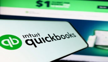Mobile phone with QuickBooks logo on screen