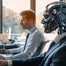 Robot employee sat next to human employee