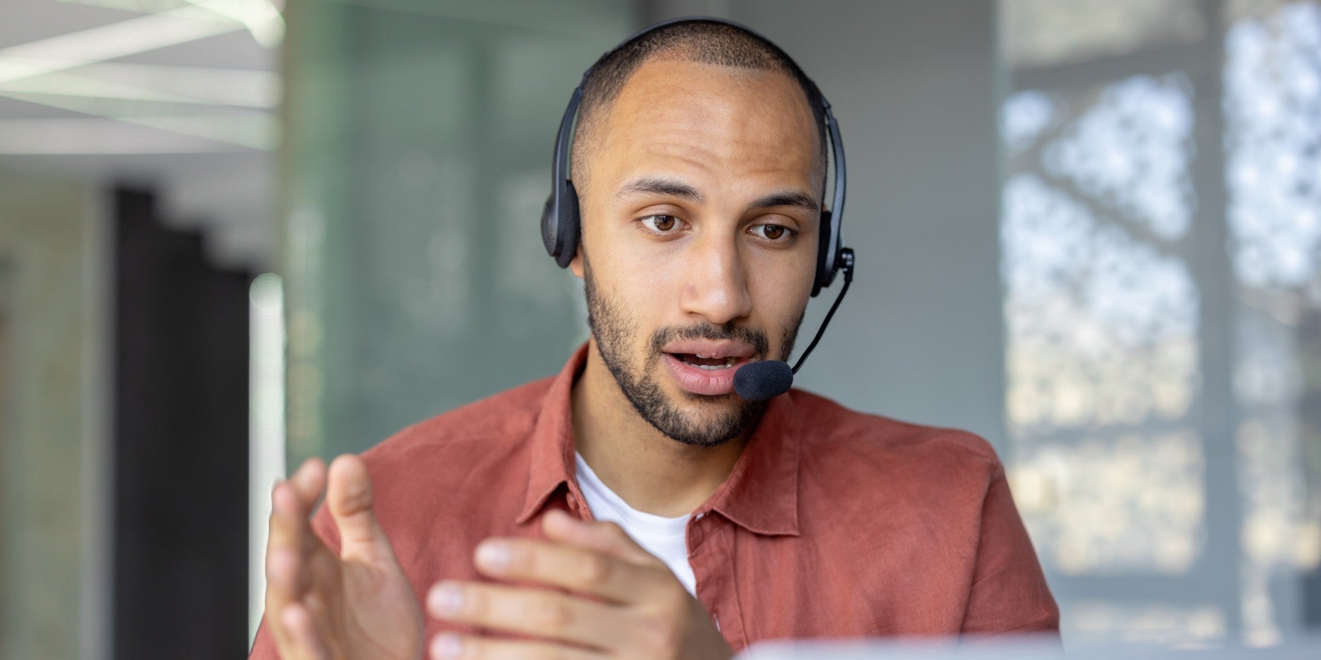 Man speaking on phone using headset