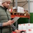 A warehouse logistics guys holds a scanner