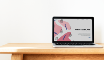 Laptop with web design template on screen